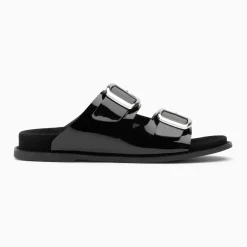 Mules plates Célia noir verni à boucles oversize